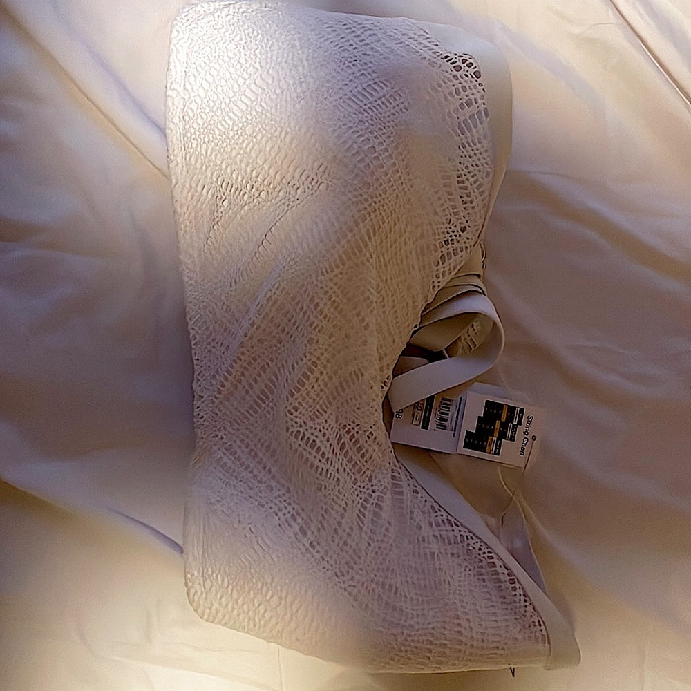 Woman’s swim top all white with nice material golden hooks!